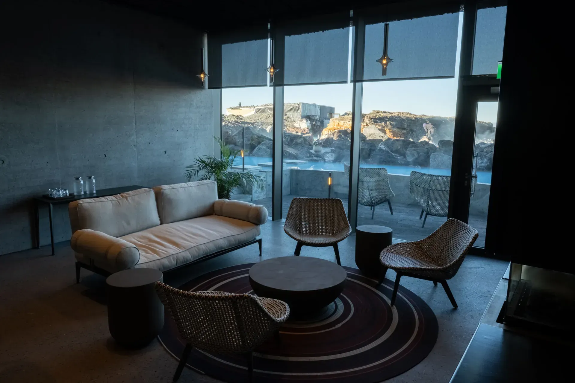 Lounge with floor-to-ceiling windows looking out over the lagoon and lava